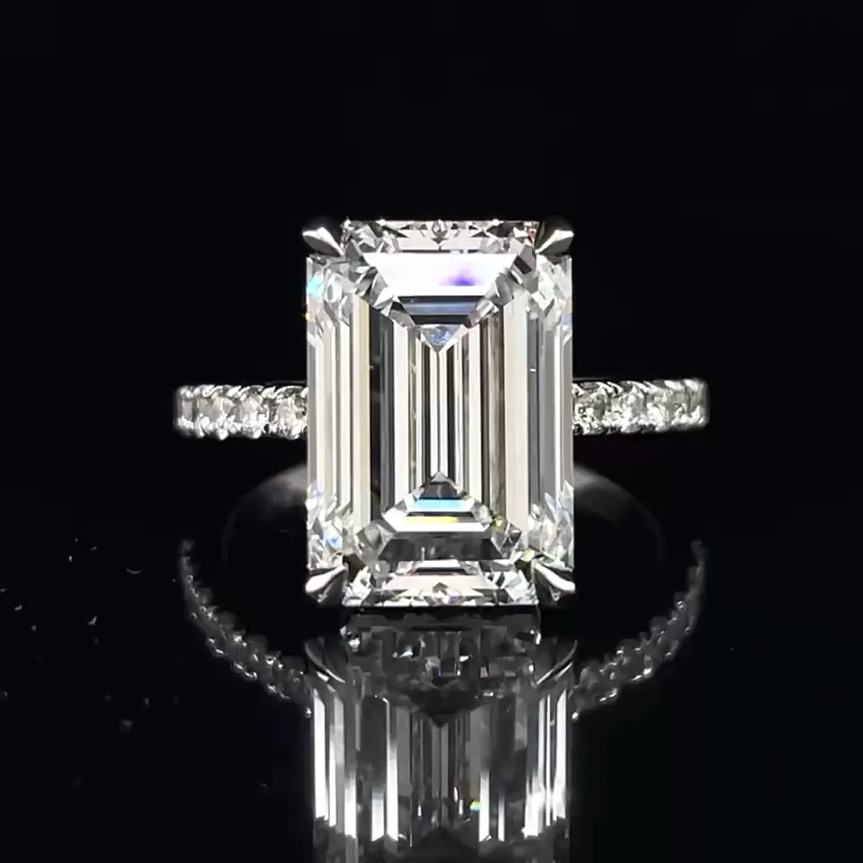 Emerald-cut diamond ring with detailed diamond setting