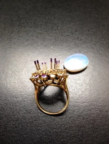 Vintage-style gold ring awaiting precise setting work